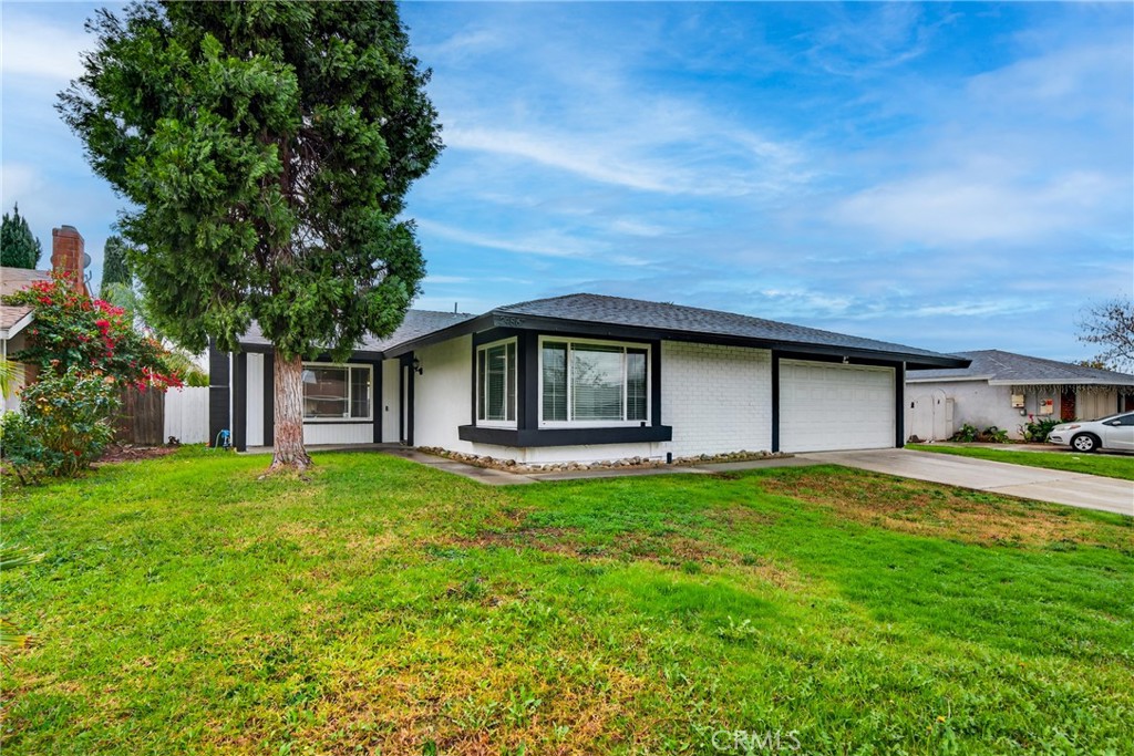 24867 Bower Street Moreno Valley, CA 92553 - Photo 44 of 46 a house view with a garden space