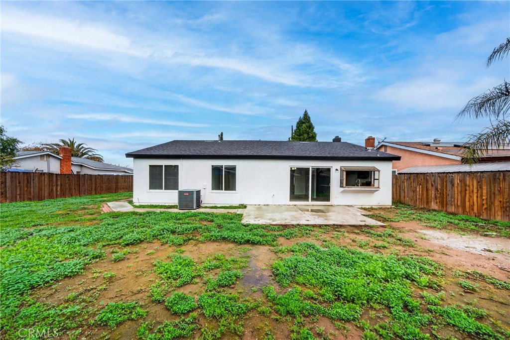 24867 Bower Street Moreno Valley, CA 92553 - Photo 46 of 46 a view of a yard in front of a house with large trees