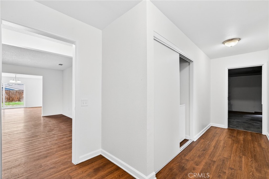 24867 Bower Street Moreno Valley, CA 92553 - Photo 10 of 46 a view of a hallway with wooden floor
