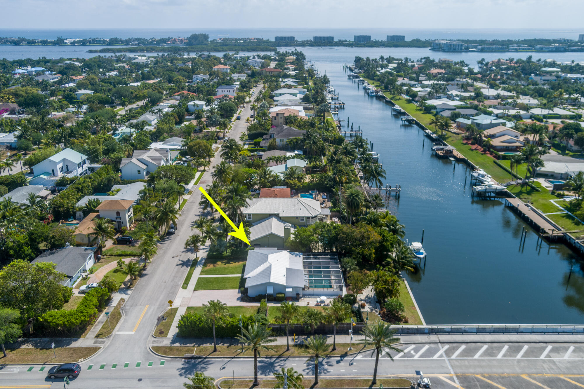 an aerial view of residential houses with outdoor space and trees