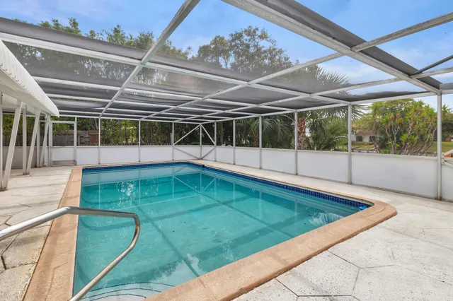 a view of a swimming pool with a patio