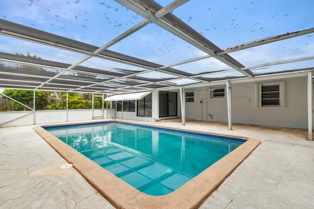 a backyard of a house with outdoor seating