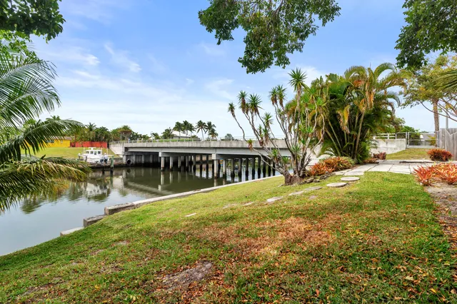 an aerial view of a house with a lake view