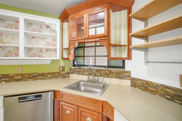 a kitchen with a stove and a refrigerator