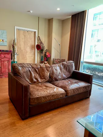 a living room with a couch and a window
