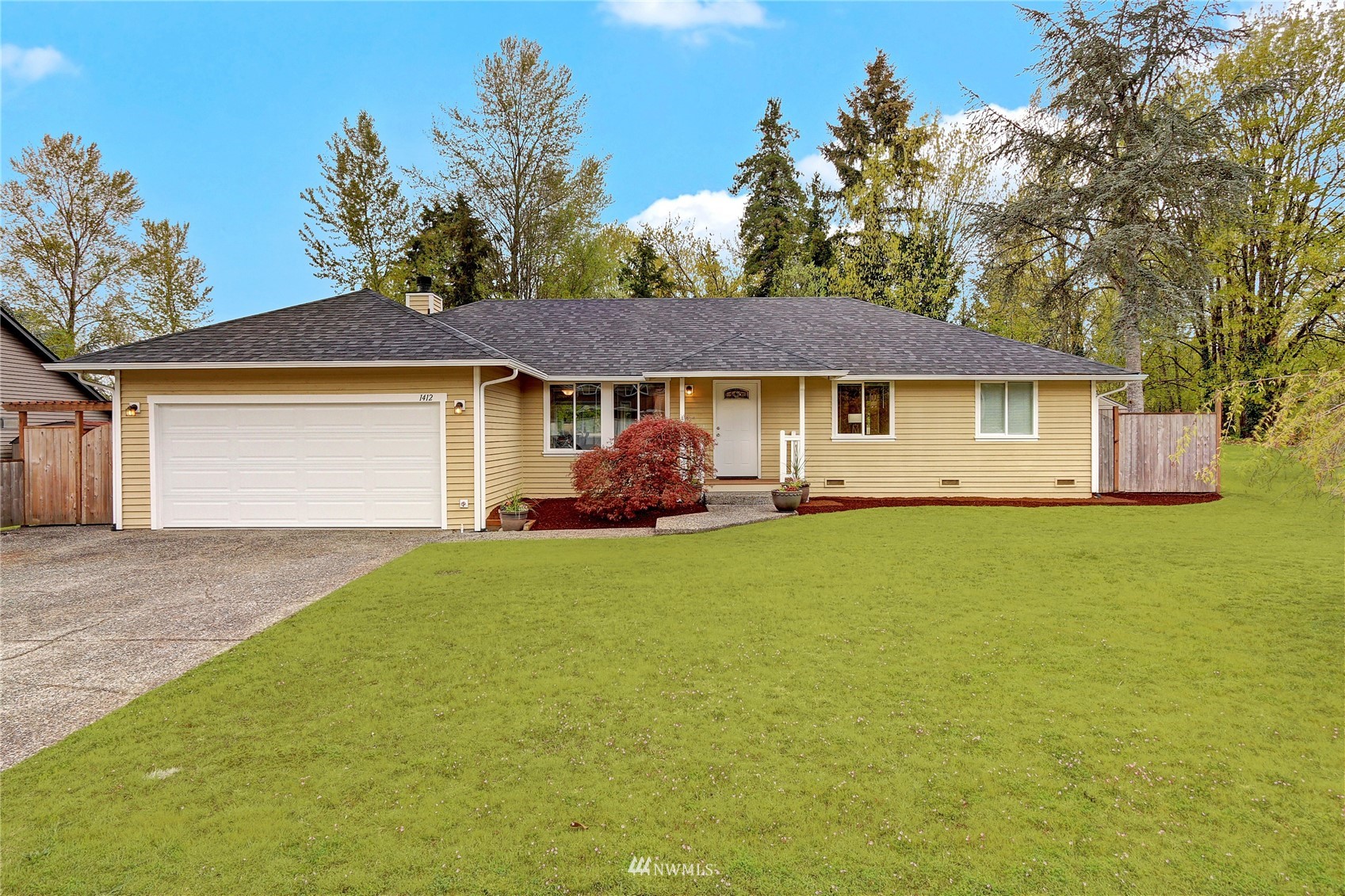 1412 234th Street Southwest Bothell, WA 98021 - Photo 1 of 20 a front view of a house with garden