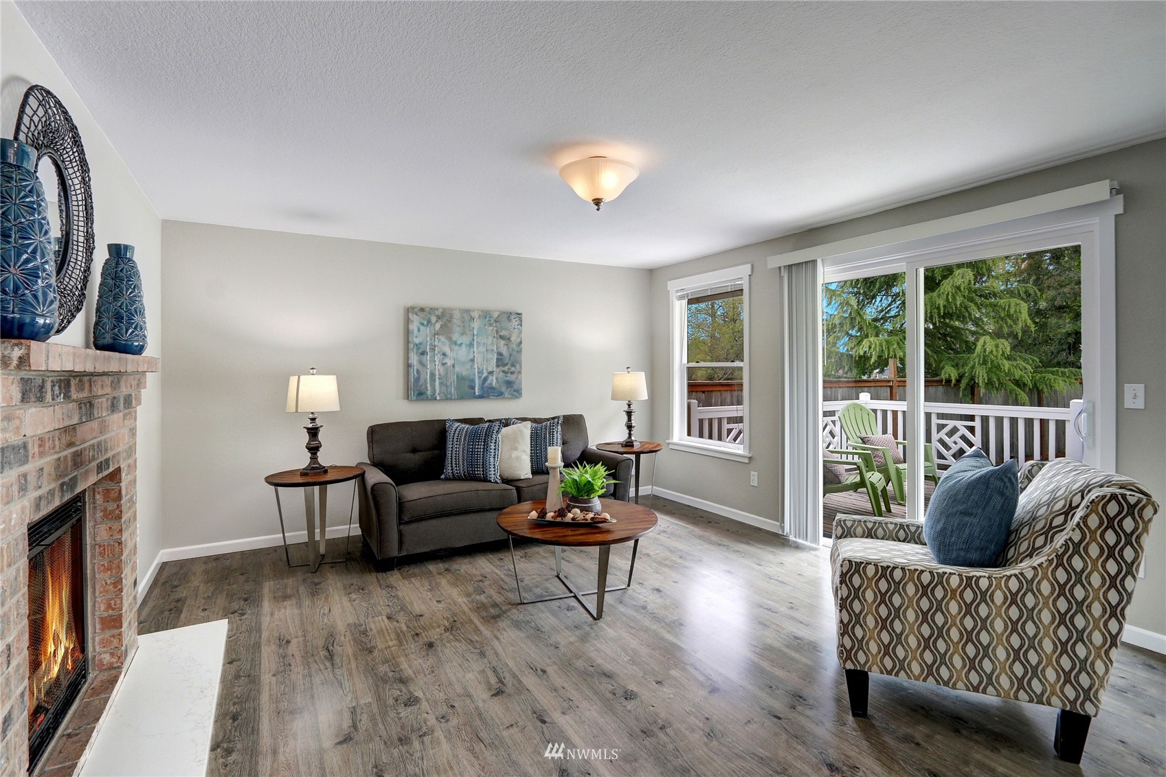 1412 234th Street Southwest Bothell, WA 98021 - Photo 11 of 20 a living room with furniture and a fireplace