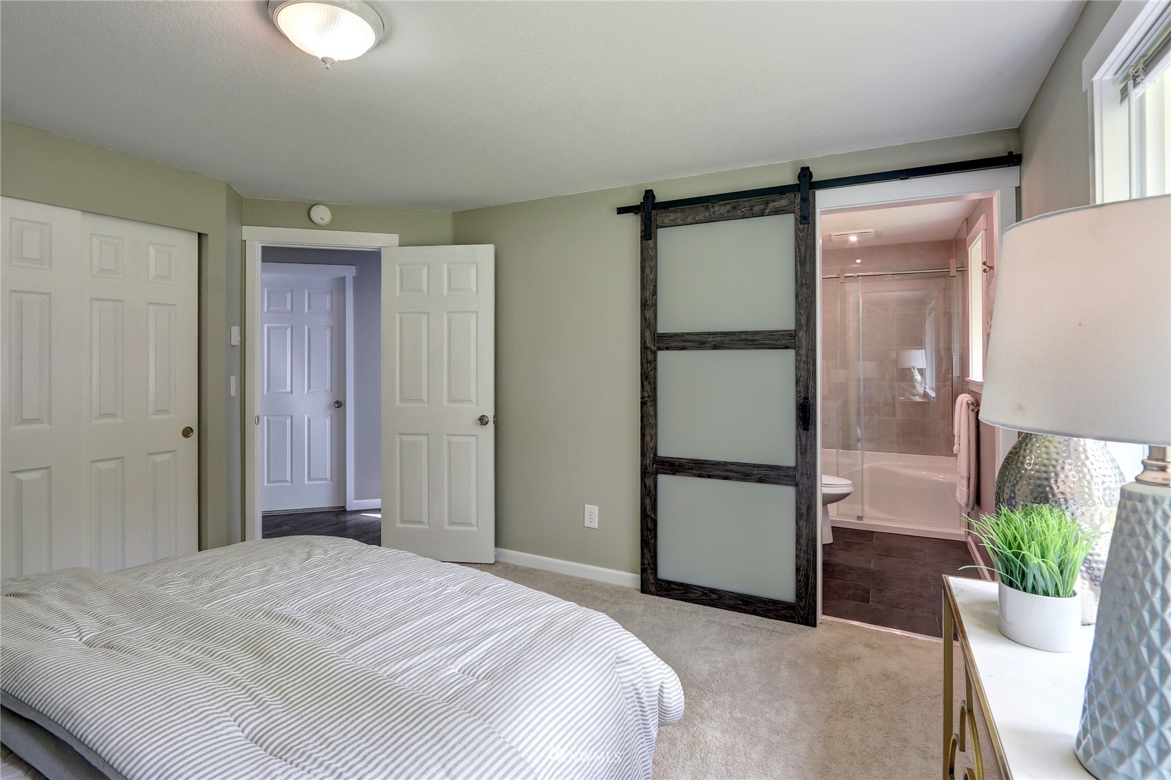1412 234th Street Southwest Bothell, WA 98021 - Photo 13 of 20 a bedroom with a bed and a couch