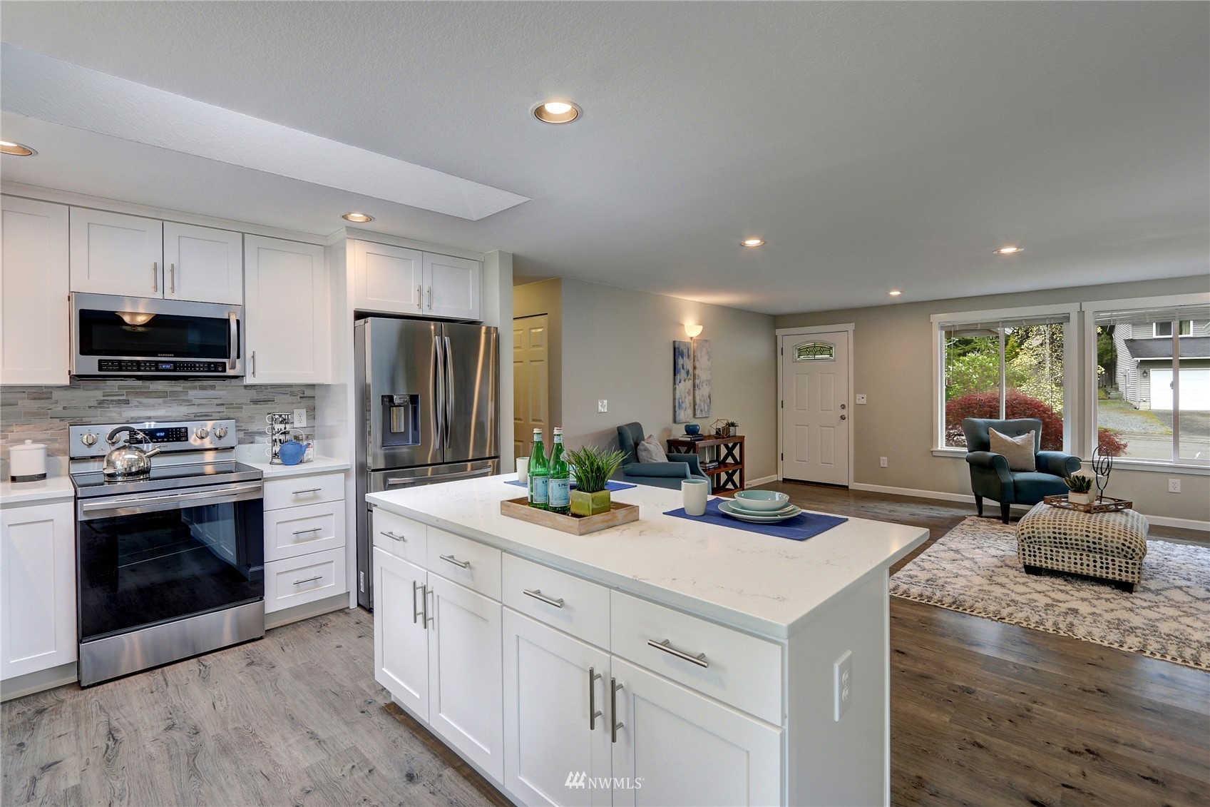 1412 234th Street Southwest Bothell, WA 98021 - Photo 7 of 20 a kitchen that has a sink and a stove top oven