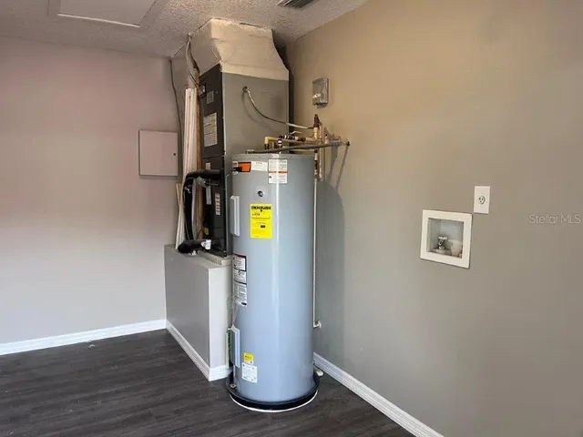 a view of hallway with wooden floor
