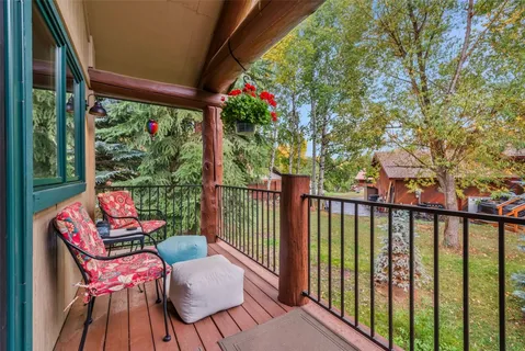a view of a two chairs in the balcony