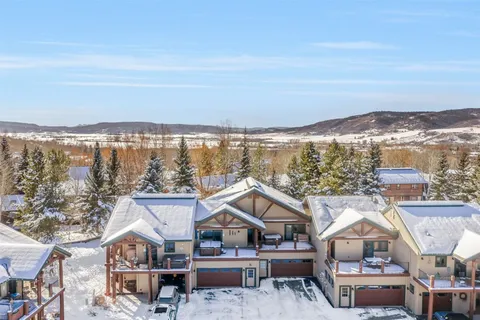 an aerial view of residential houses and city street