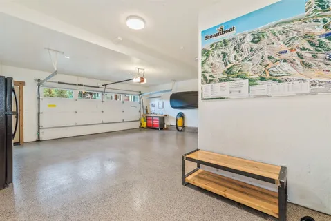 a view of room with gym equipment and a large window