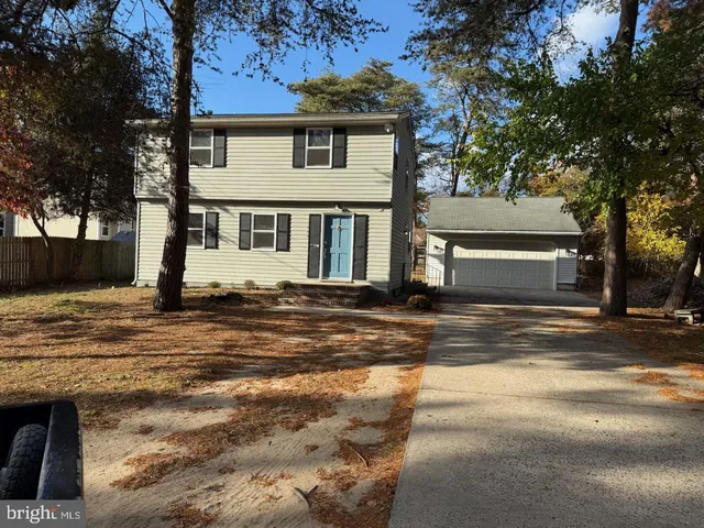 a view of a house with a snow in the background