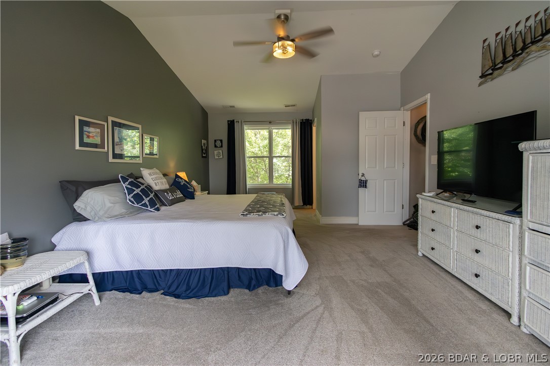 1106 Red Bud Road Osage Beach, MO 65065 - Photo 10 of 31 .... first large bedroom upstairs with vaulted cei