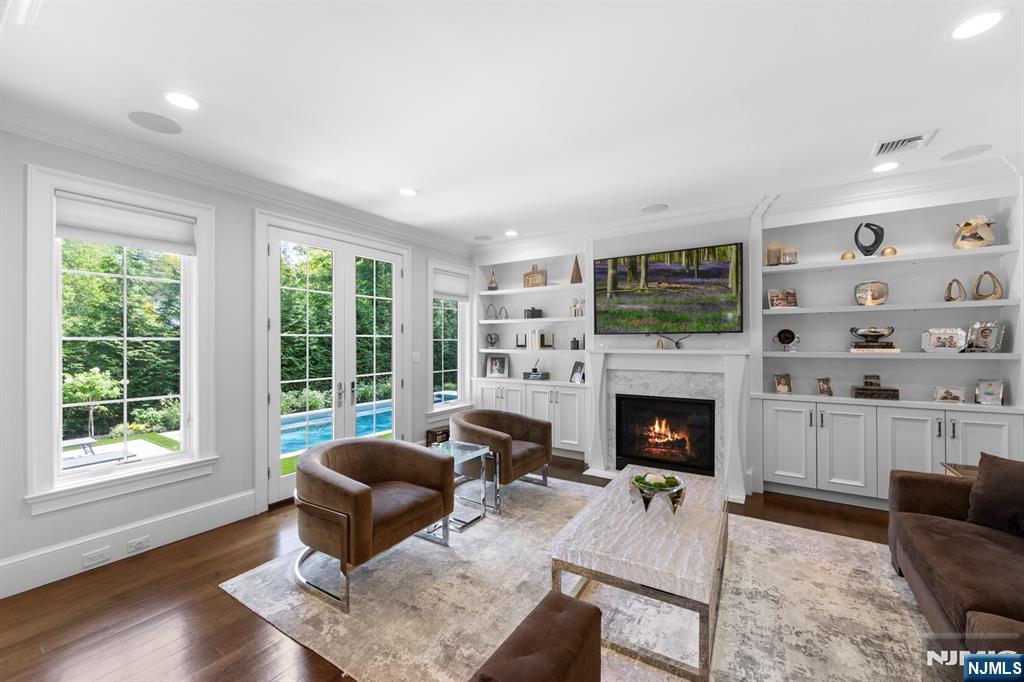199 Whitman Street Haworth, NJ 07641 - Photo 20 of 50 a living room with furniture fireplace and window