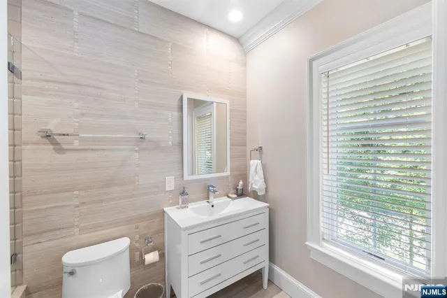 a bathroom with a toilet sink and shower