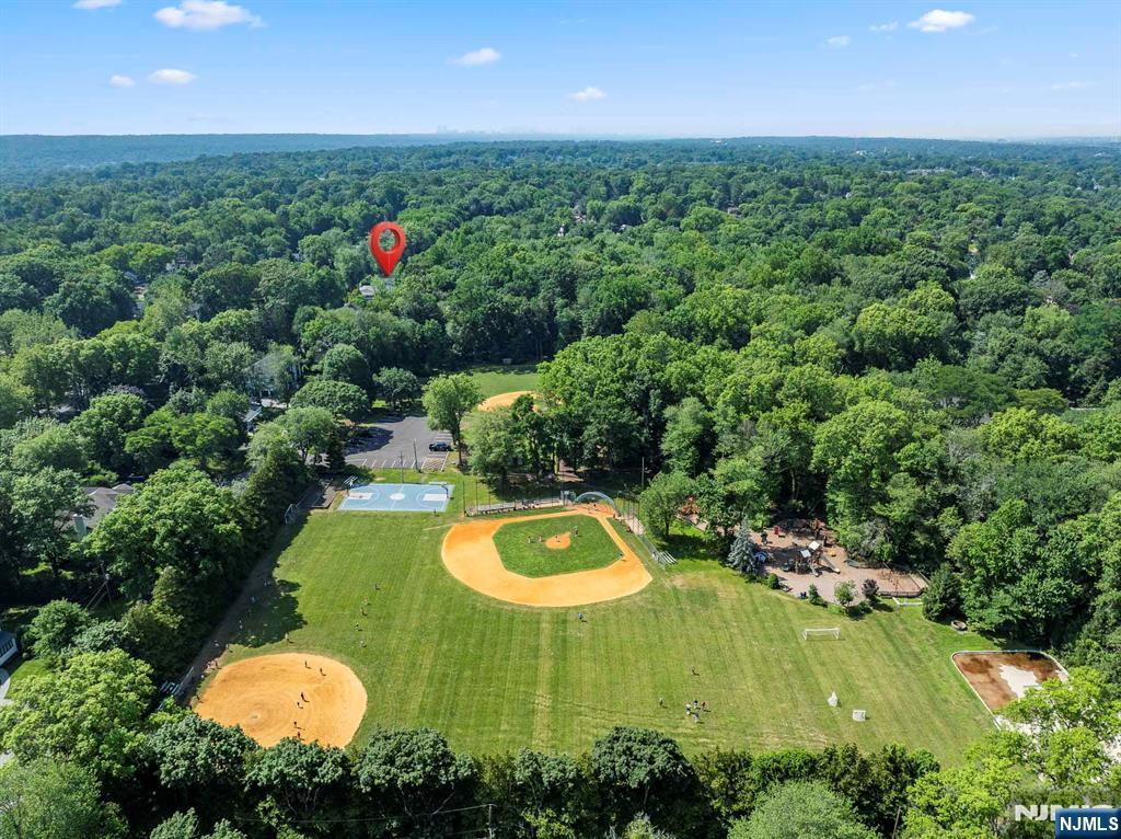 199 Whitman Street Haworth, NJ 07641 - Photo 46 of 50 an aerial view of a house with swimming pool and a yard