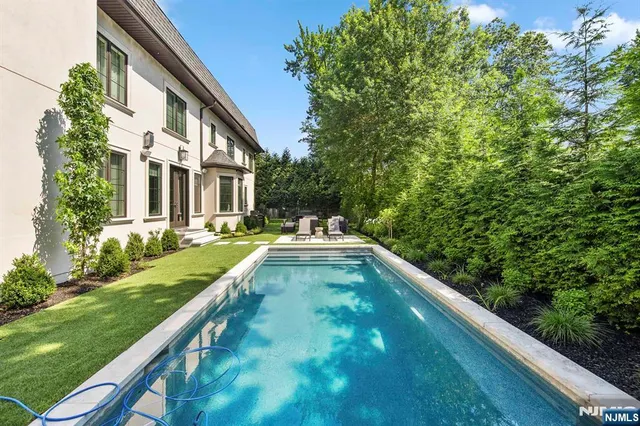 a backyard of a house with outdoor seating