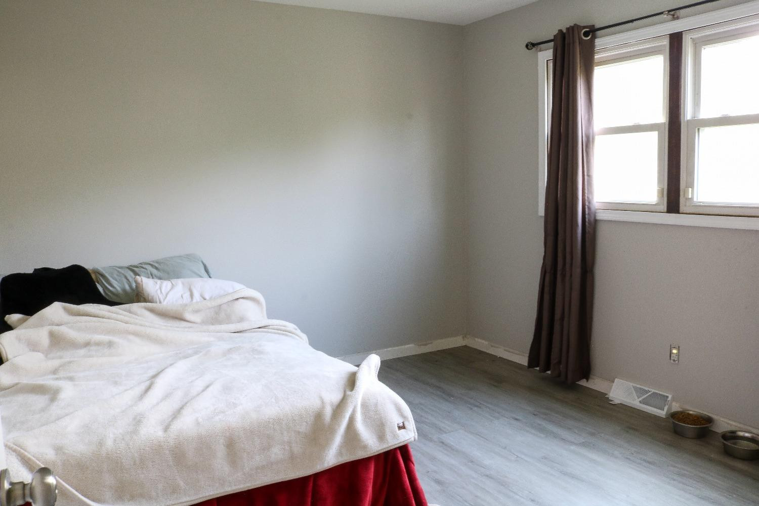 8469 Morse Court Crown Point, IN 46307 - Photo 14 of 33 a bed sitting in a bedroom next to a window