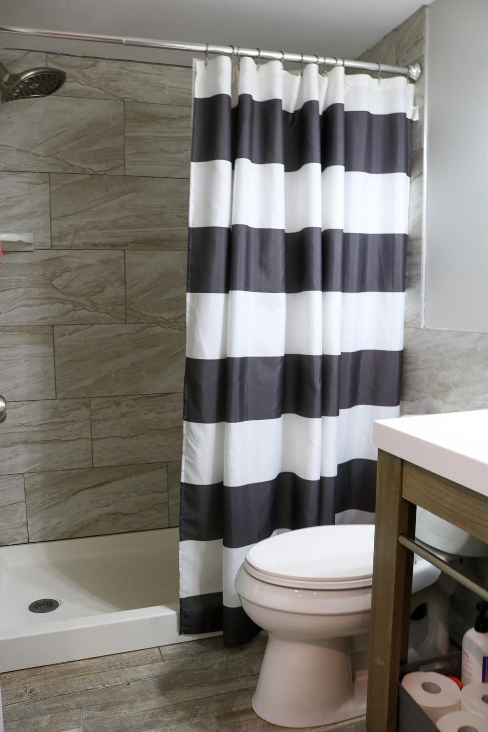 8469 Morse Court Crown Point, IN 46307 - Photo 23 of 33 a bathroom with a toilet and a shower curtain