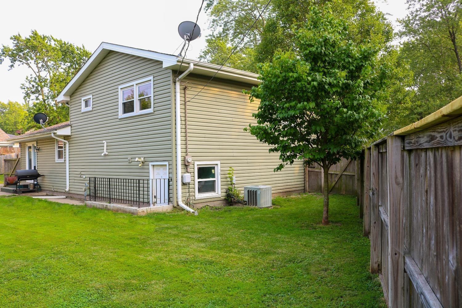 8469 Morse Court Crown Point, IN 46307 - Photo 28 of 33 a view of a house with a yard and sitting area