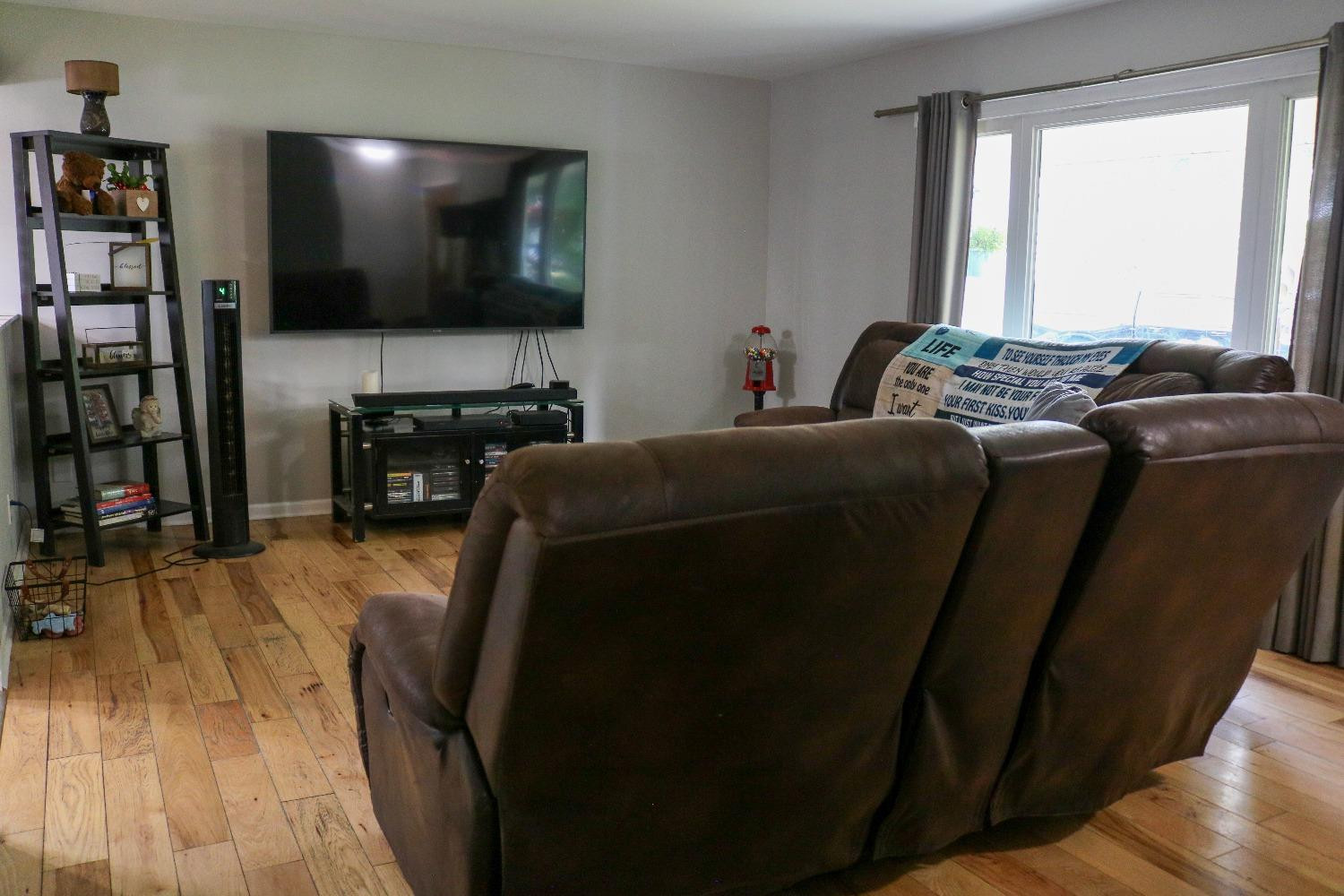 8469 Morse Court Crown Point, IN 46307 - Photo 6 of 33 a living room with furniture and a flat screen tv