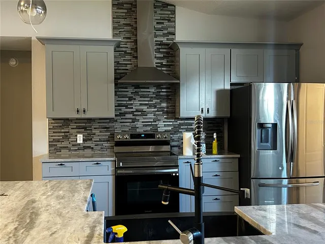 a view of wooden floor and windows in an empty room