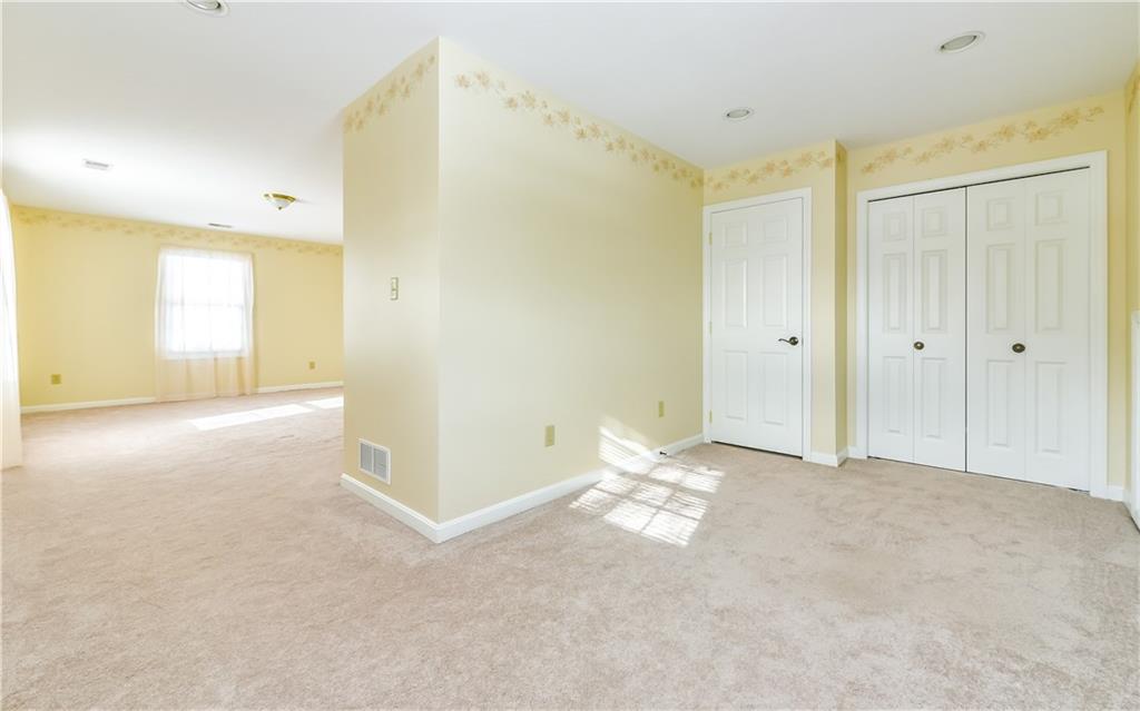 676 Deer Creek Road Valencia, PA 16059 - Photo 18 of 25 Bedroom #2 sitting area has a second closet. Door on left contains second HVAC system.