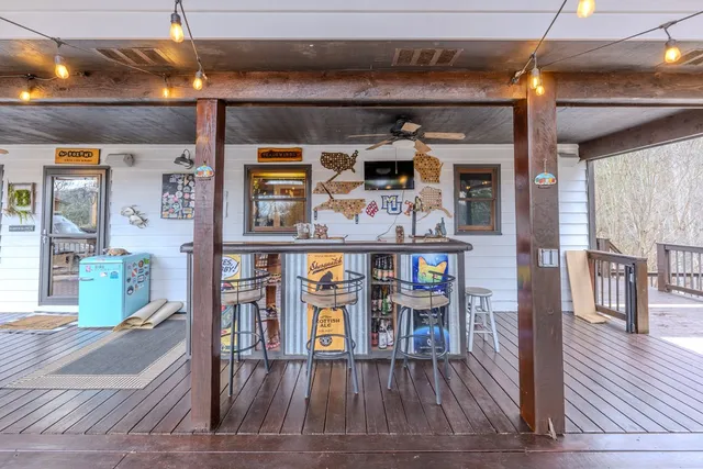 a view of a living room with furniture and wooden floor