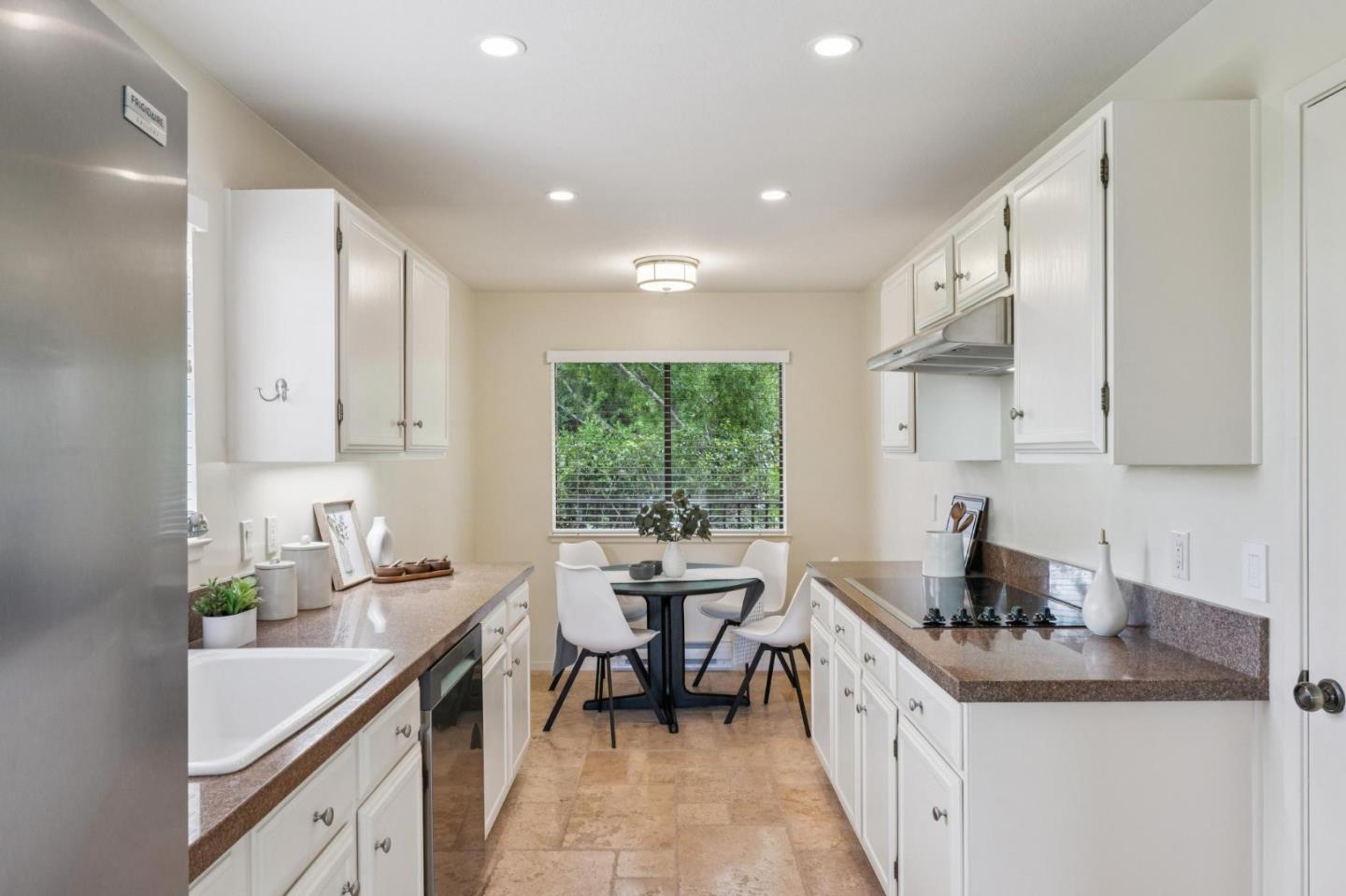 8 Shepherds Knoll Pebble Beach, CA 93953 - Photo 14 of 47 a kitchen with sink cabinets and window
