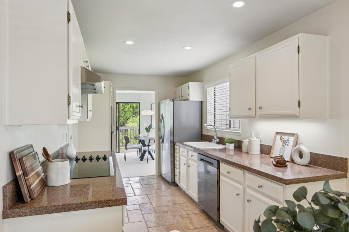 8 Shepherds Knoll Pebble Beach, CA 93953 - Photo 16 of 47 a kitchen with stainless steel appliances granite countertop a refrigerator and a sink
