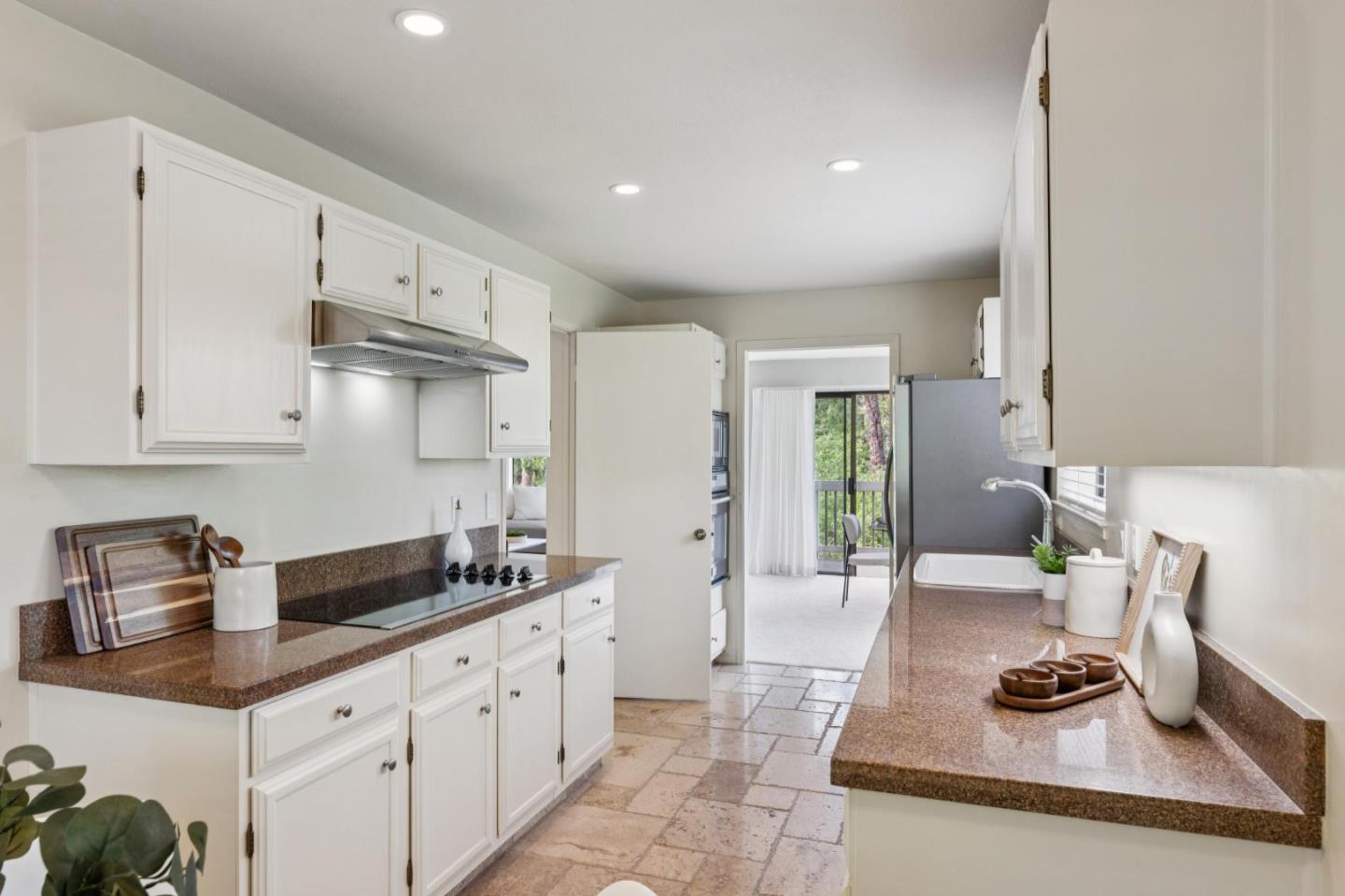 8 Shepherds Knoll Pebble Beach, CA 93953 - Photo 17 of 47 a kitchen with granite countertop a sink and cabinets