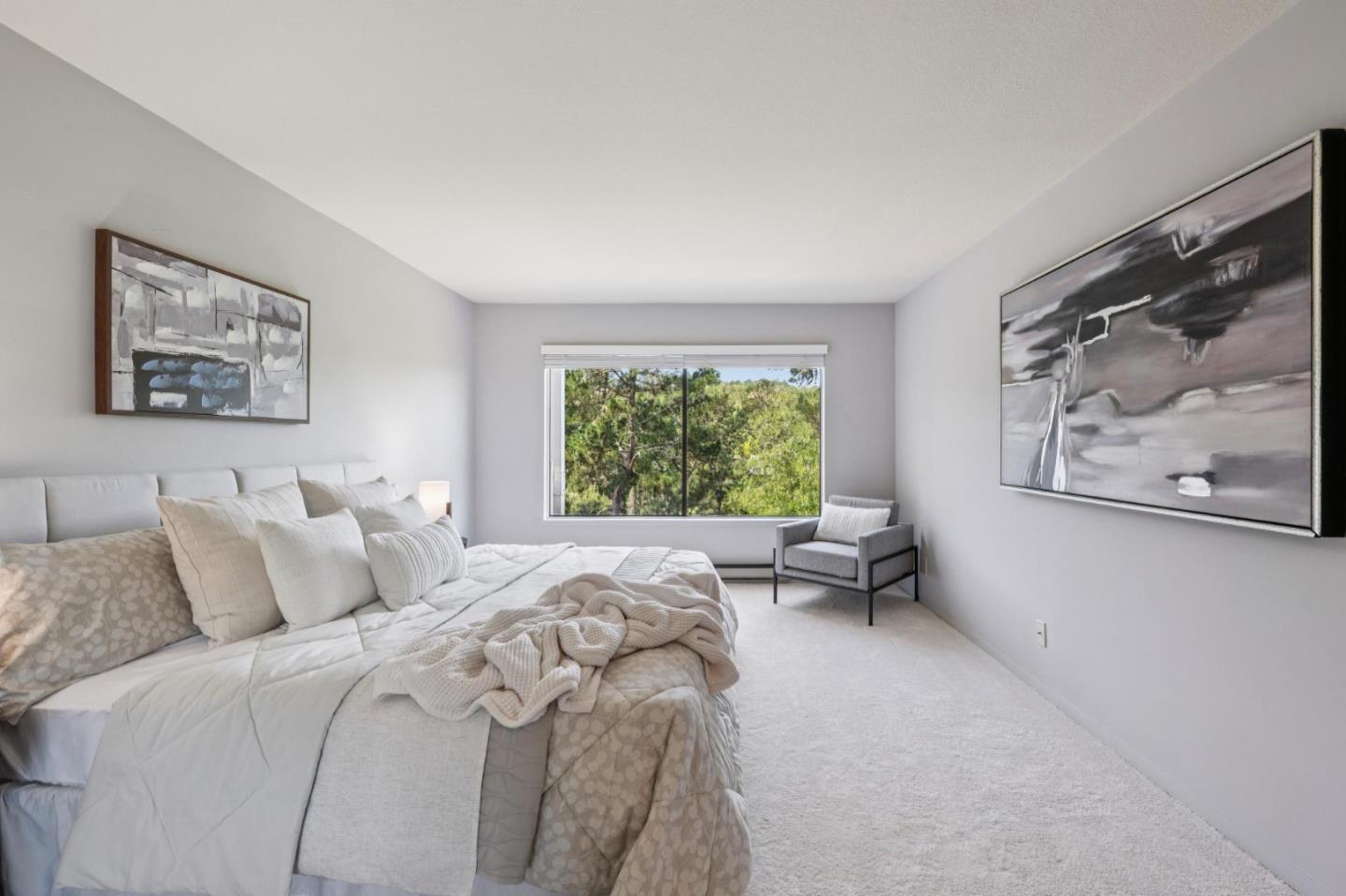 8 Shepherds Knoll Pebble Beach, CA 93953 - Photo 19 of 47 a bedroom with a bed and a painting on the wall