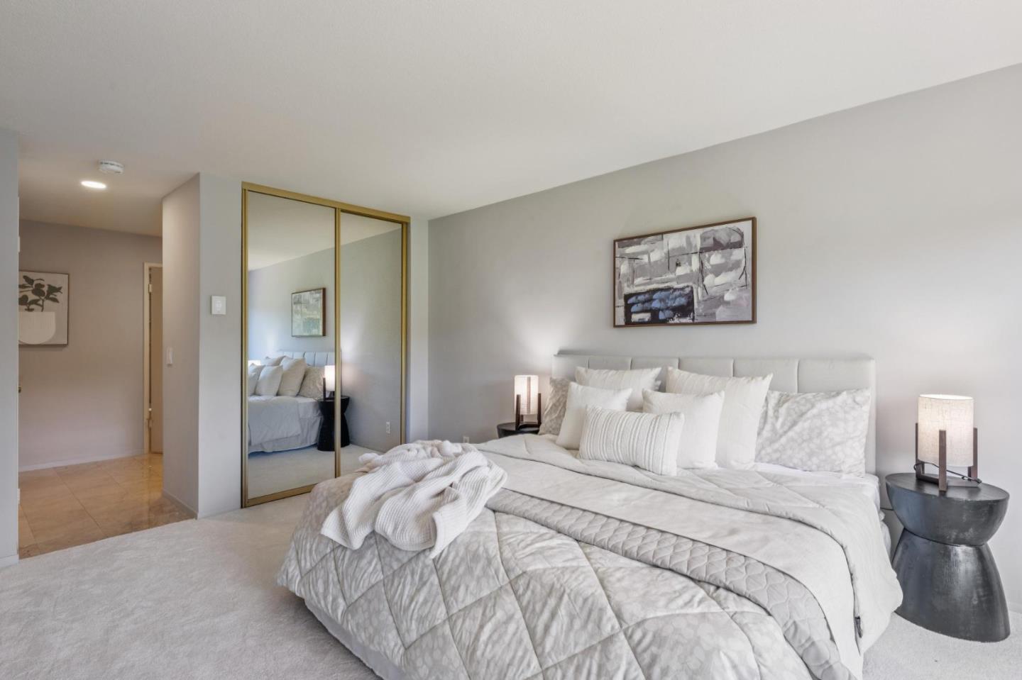 8 Shepherds Knoll Pebble Beach, CA 93953 - Photo 22 of 47 a bedroom with a bed and a painting on the wall