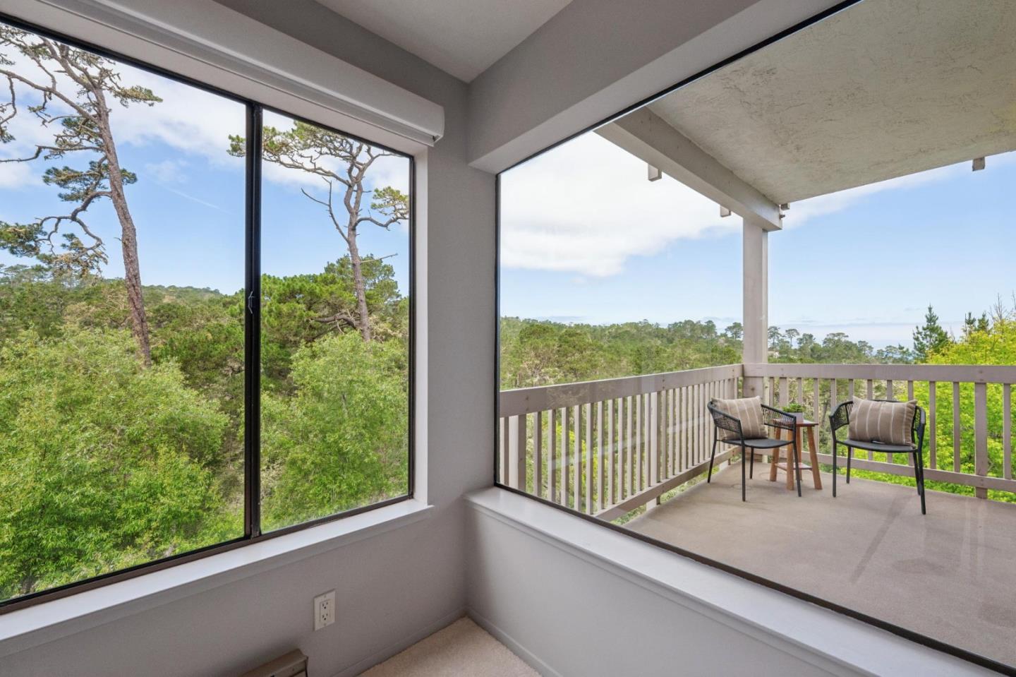 8 Shepherds Knoll Pebble Beach, CA 93953 - Photo 7 of 47 a view of a city from a balcony with chairs
