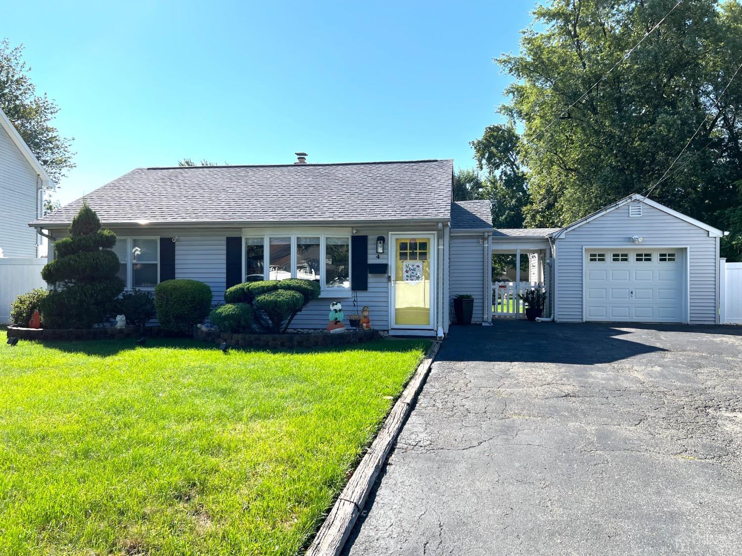 4 Crescent Road Edison, NJ 08817 - Photo 1 of 24 a front view of a house with yard and green space