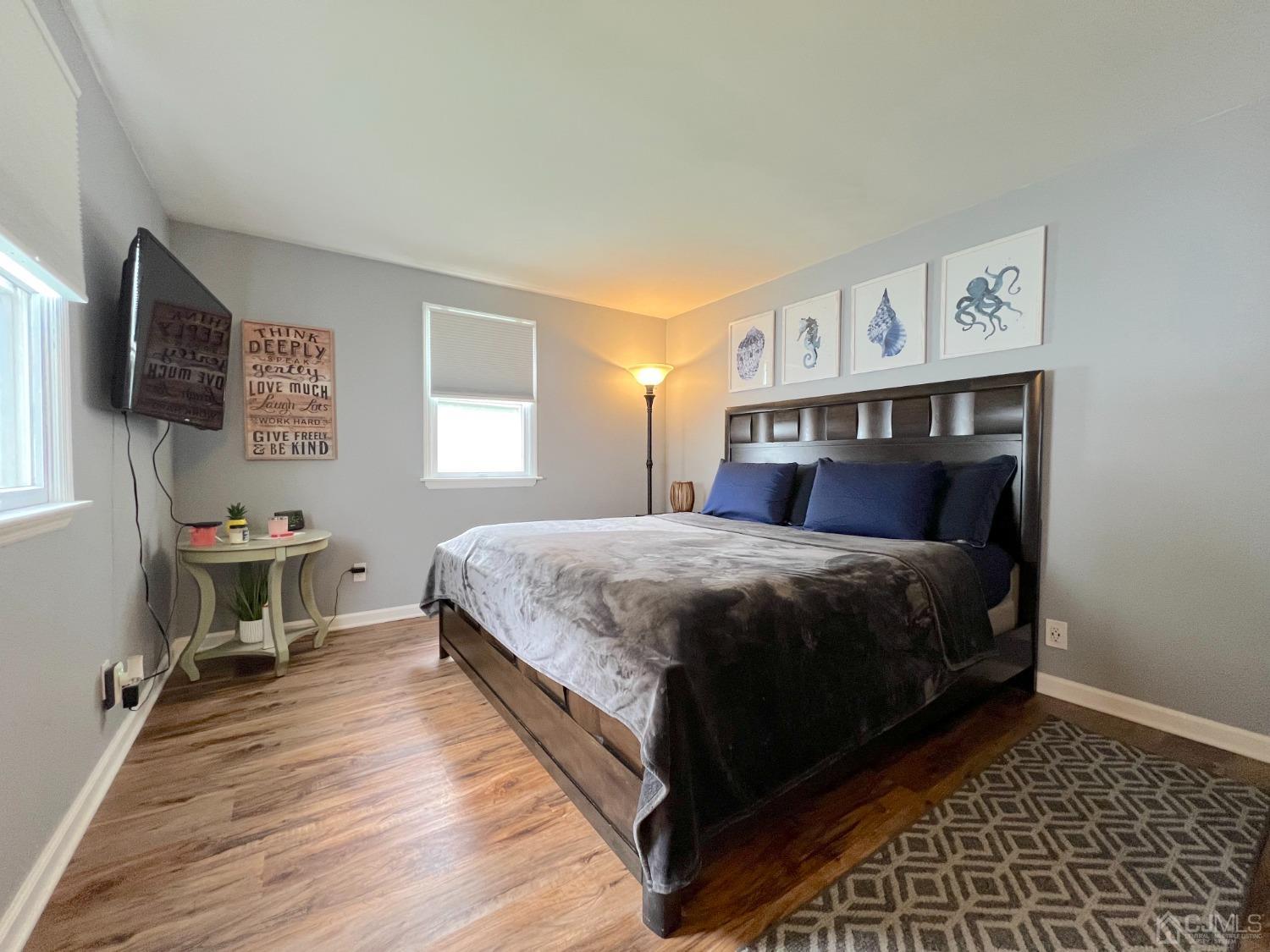 4 Crescent Road Edison, NJ 08817 - Photo 13 of 24 a bedroom with a bed and a flat screen tv