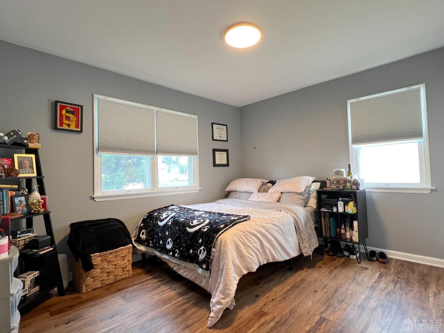 4 Crescent Road Edison, NJ 08817 - Photo 16 of 24 a bedroom with a bed and wooden floor