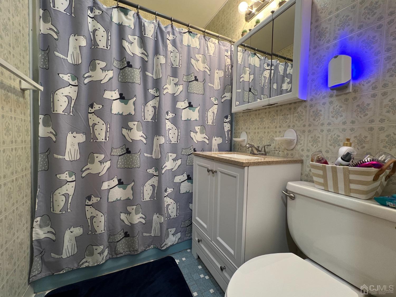 4 Crescent Road Edison, NJ 08817 - Photo 18 of 24 a bathroom with a granite countertop toilet sink and mirror