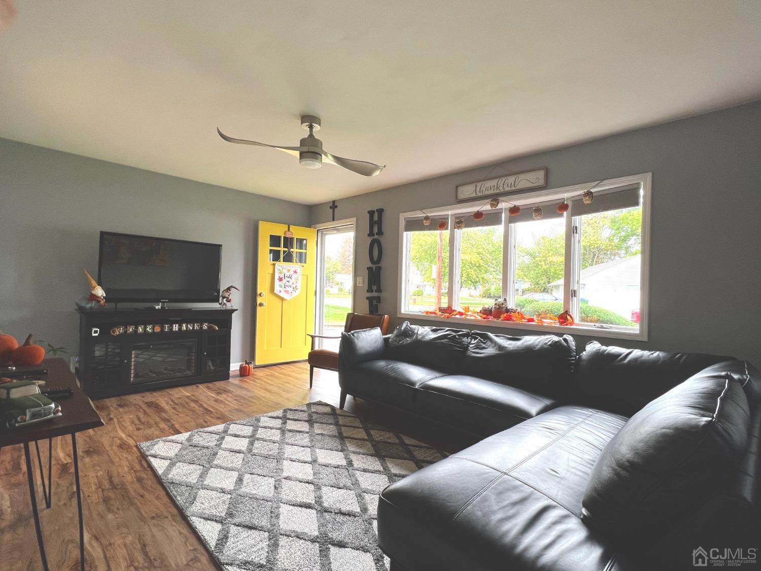4 Crescent Road Edison, NJ 08817 - Photo 6 of 24 a living room with furniture and a floor to ceiling window