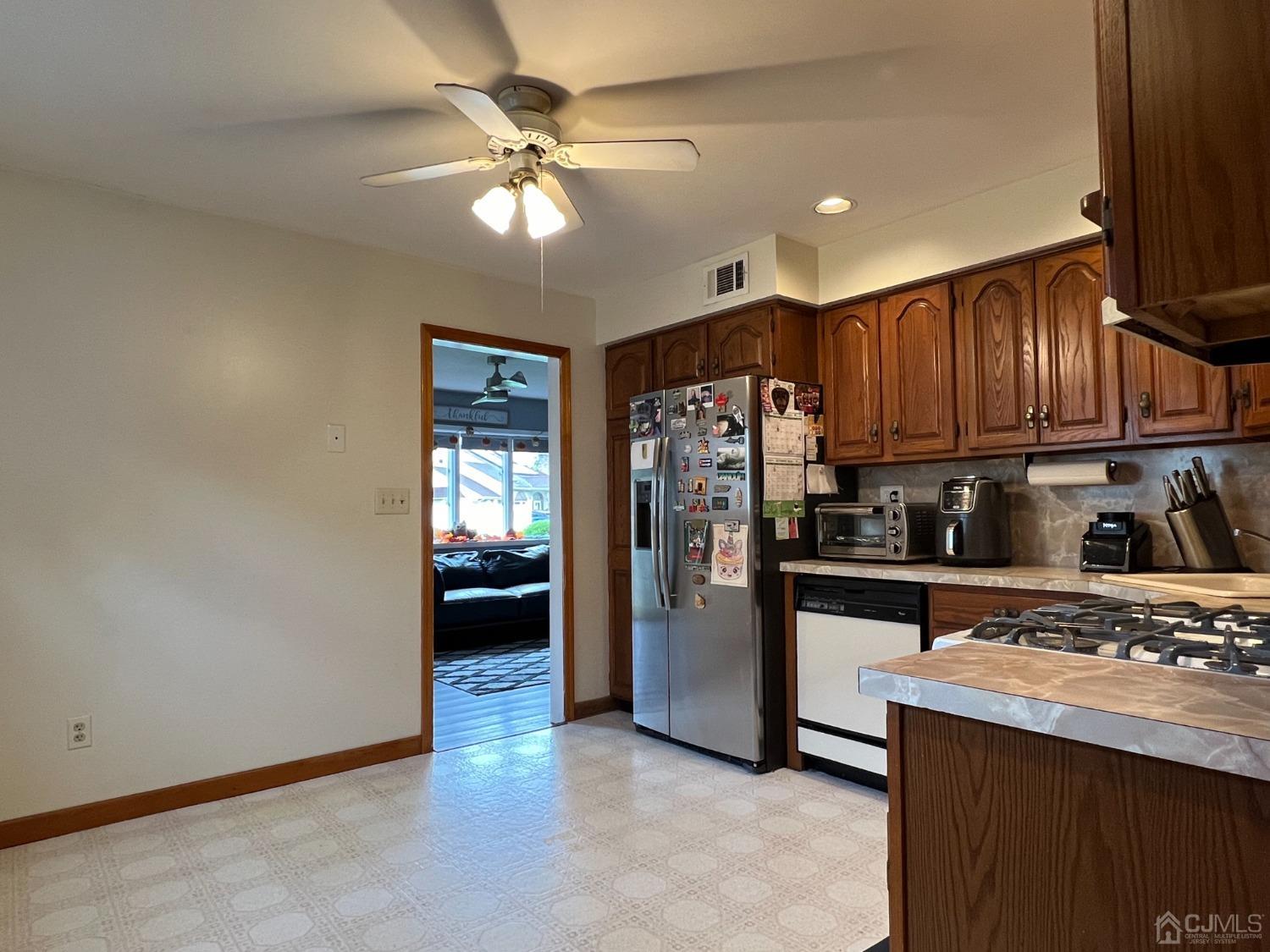 4 Crescent Road Edison, NJ 08817 - Photo 9 of 24 a kitchen with stainless steel appliances granite countertop a refrigerator a stove and a sink