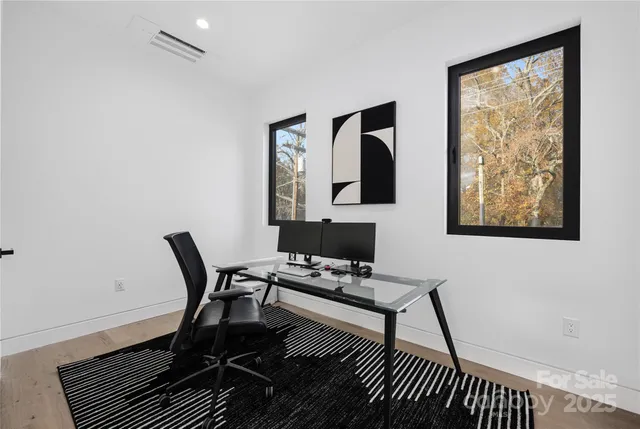 a work room with furniture and a window