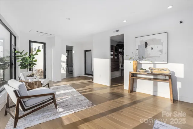a living room with stainless steel appliances kitchen island granite countertop furniture and a kitchen view