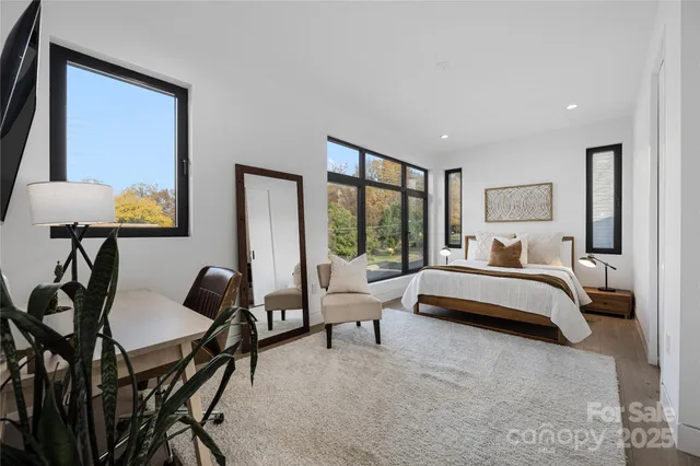 a bedroom with furniture and a window