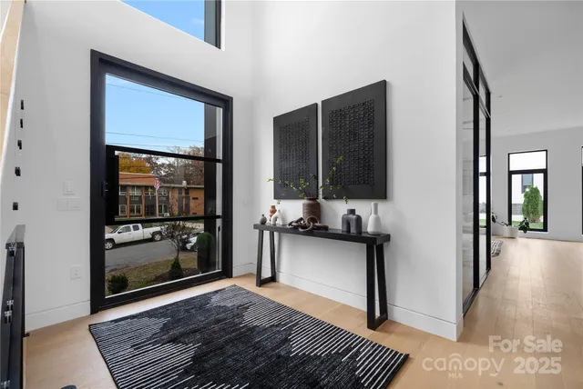 a kitchen with granite countertop a refrigerator and a sink