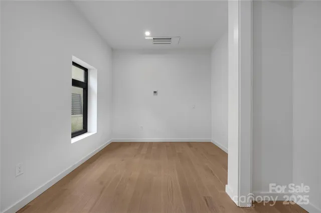 a view of balcony with two chairs and a rug