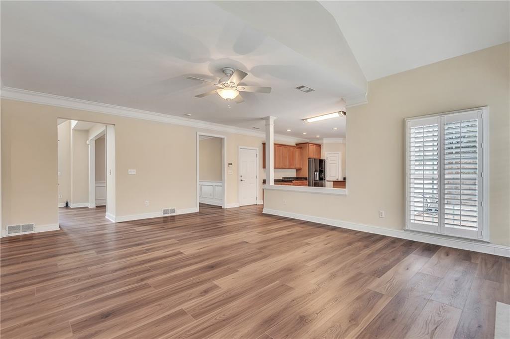 4115 Montvale Crossing Cumming, GA 30041 - Photo 15 of 38 a view of an empty room with window and wooden floor