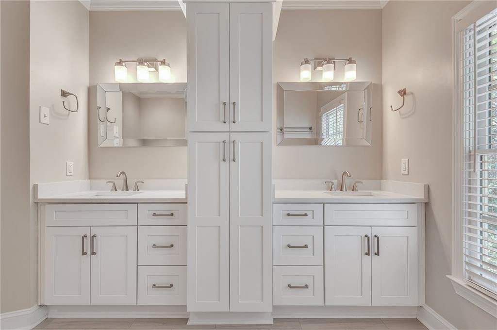 4115 Montvale Crossing Cumming, GA 30041 - Photo 25 of 38 a bathroom with double vanity white cabinets and two mirror