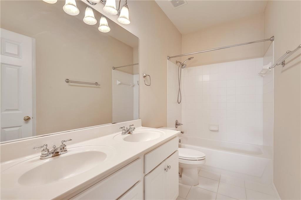 4115 Montvale Crossing Cumming, GA 30041 - Photo 34 of 38 a bathroom with a sink a toilet and shower